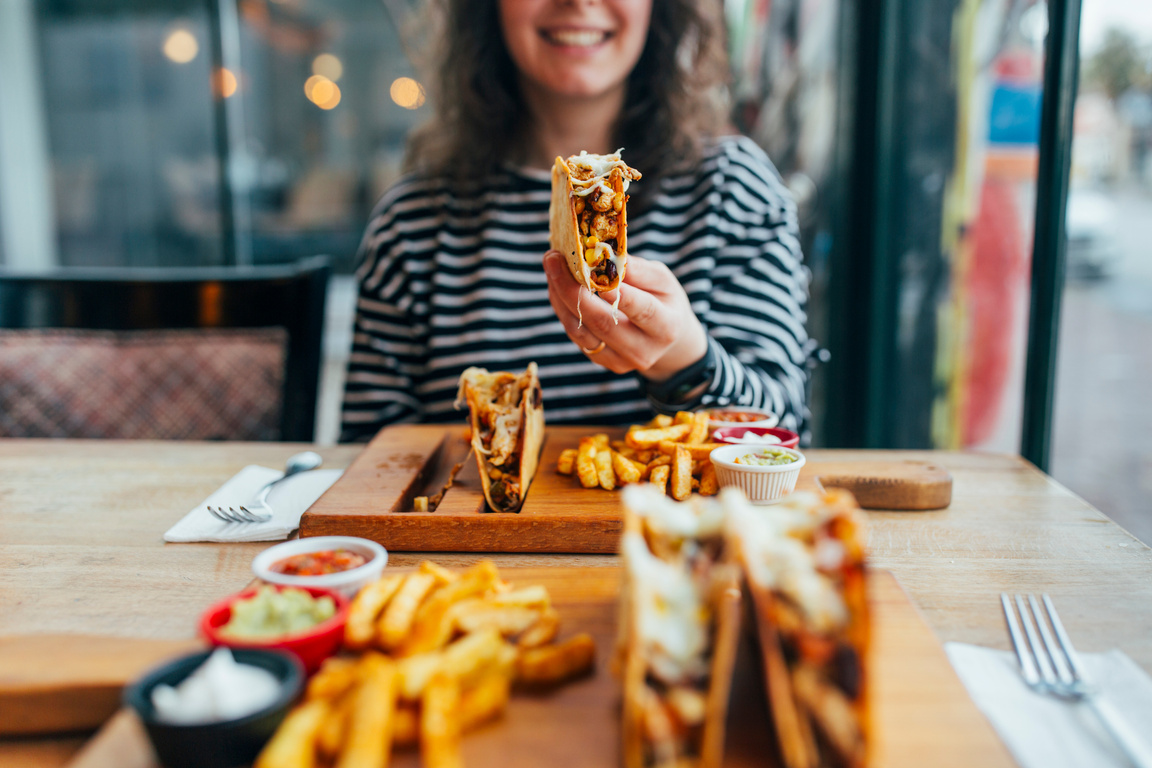 Woman Eating Taco